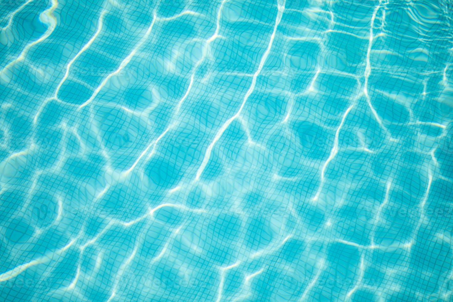 Surface of blue swimming pool, background of water in swimming pool
