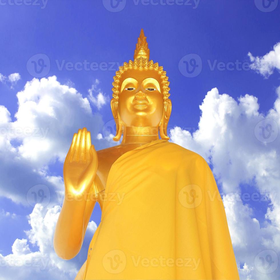 Golden buddha on bule sky  background photo