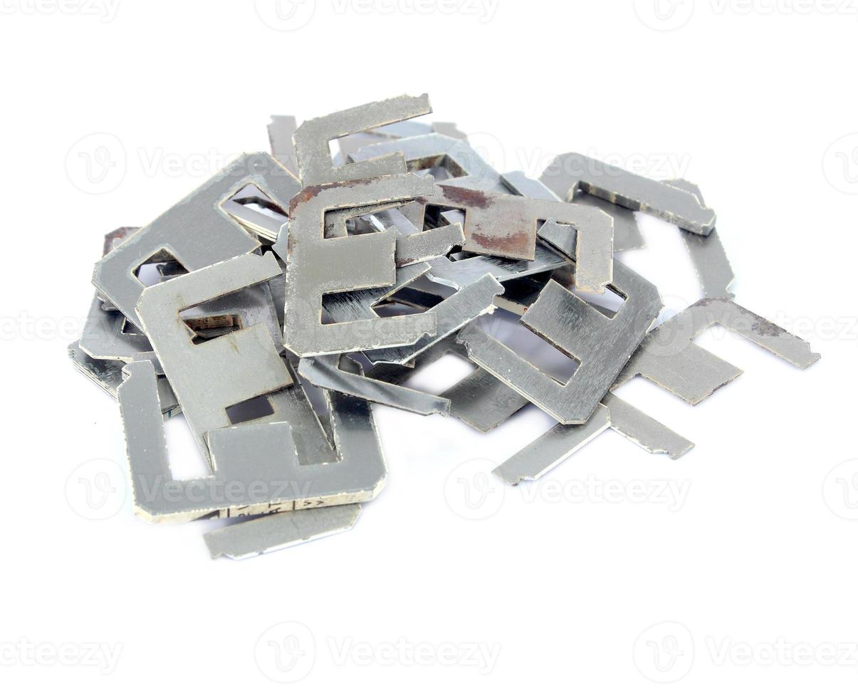 Old scrapheap of silicon steel on white background photo