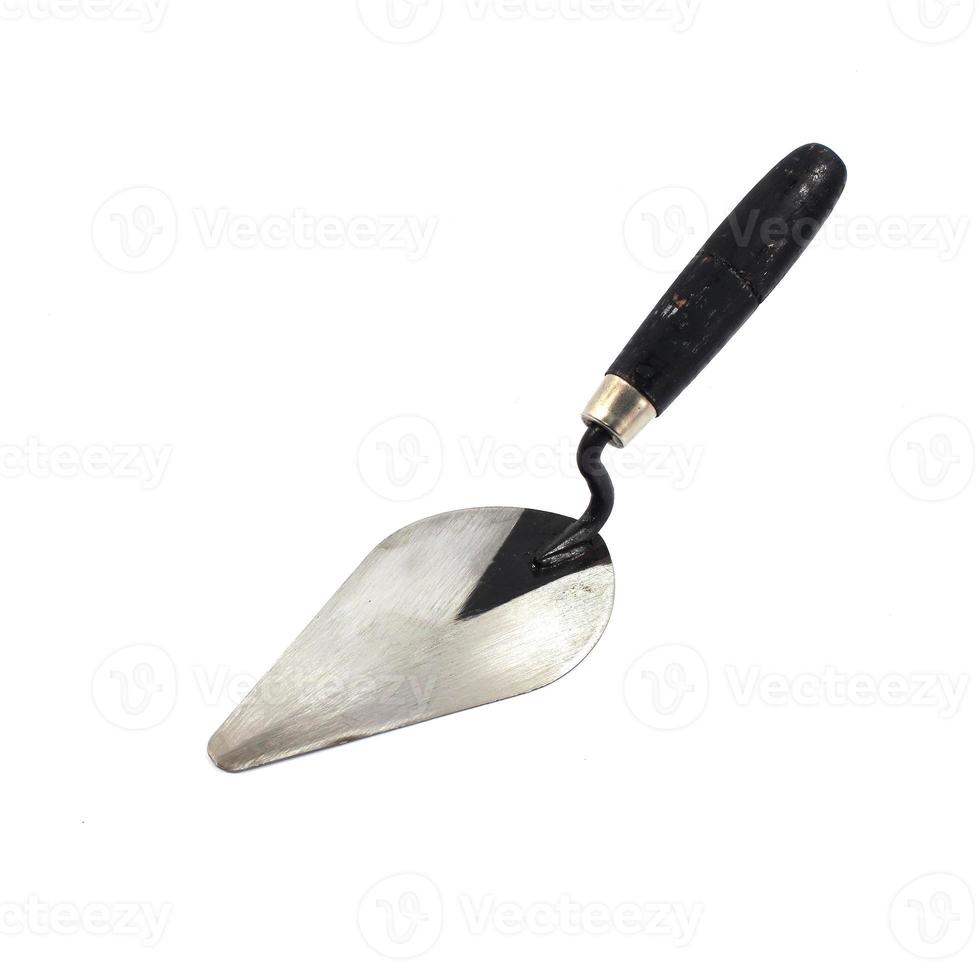 Old trowel on isolated white background photo