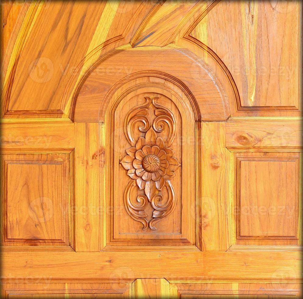 Carved pattern on wood, element of decor photo