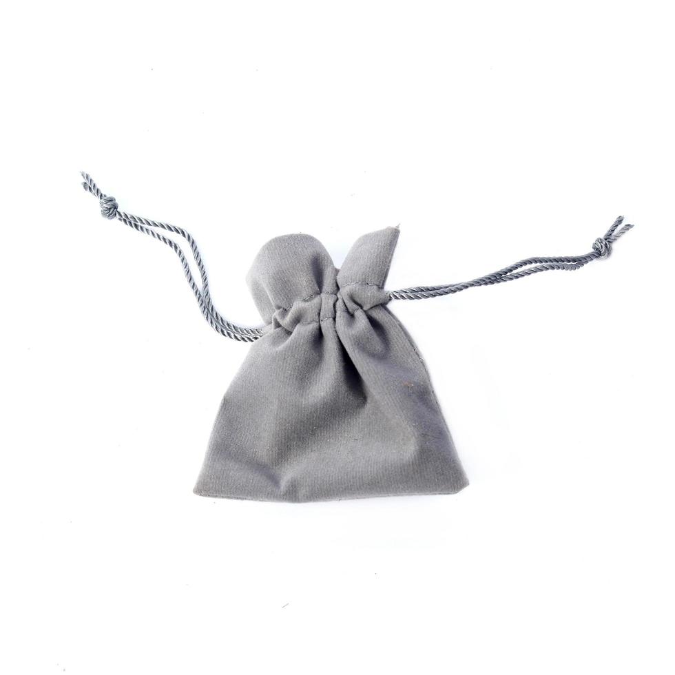 Empty burlap pouch on white background photo