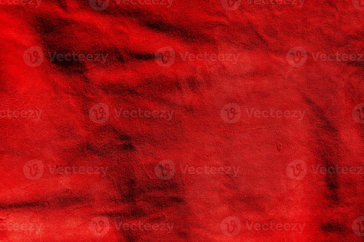 Red matte background of suede. Velvet texture of seamless leather. Red suede texture. photo