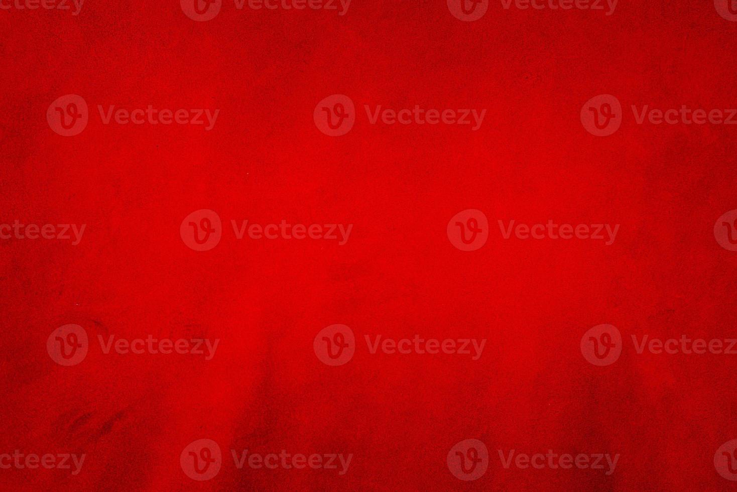 Red matte background of suede. Velvet texture of seamless leather. Red suede texture. photo