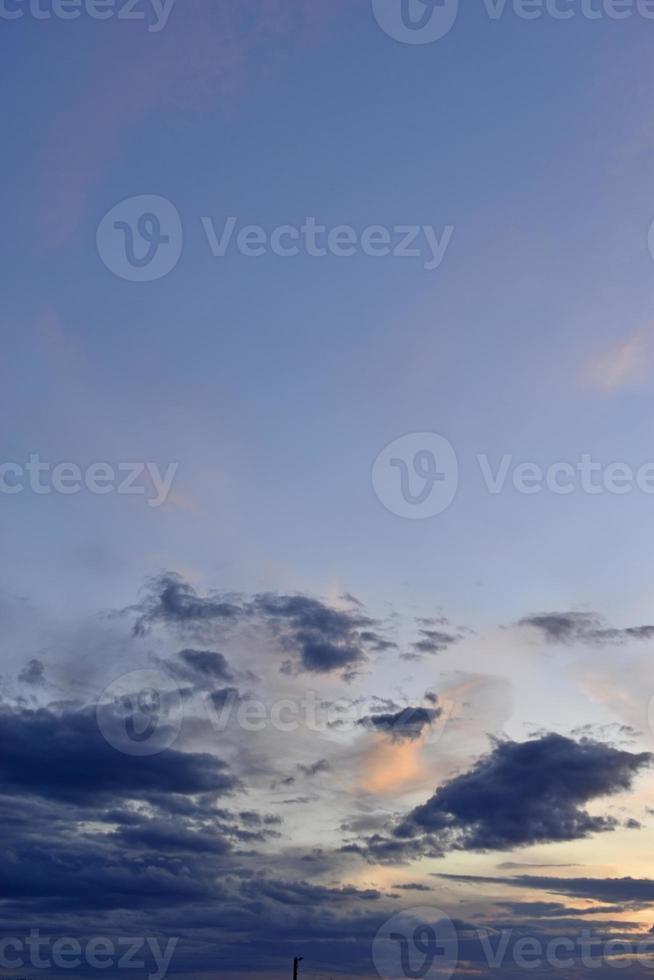 Evening sunset with blue and yellow clouds photo