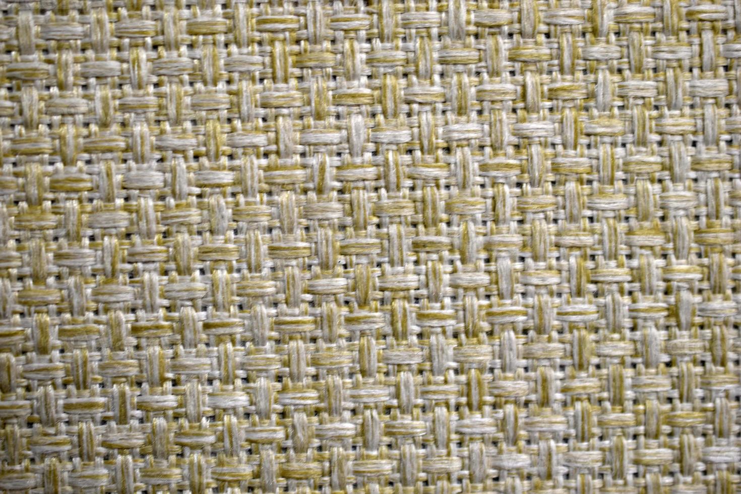 Yellow carpet fabric background close-up with threads photo