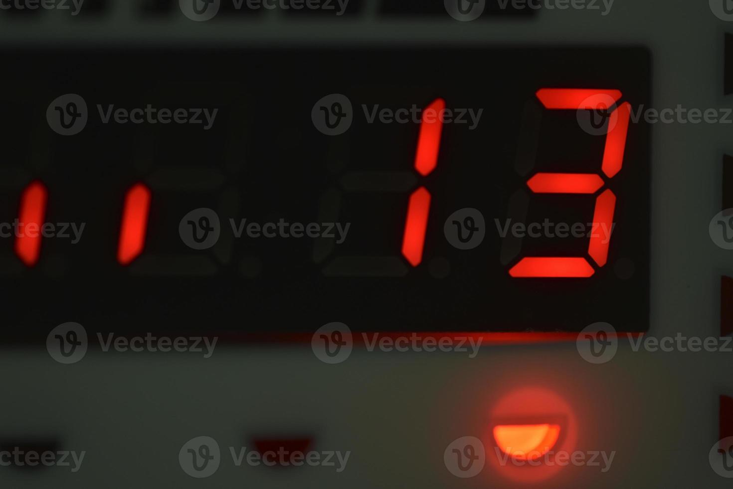 The number 13 on the electronic clock display photo