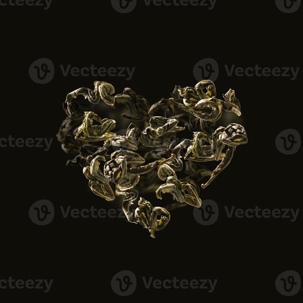 green tea leaves in flight in the shape of a heart photo