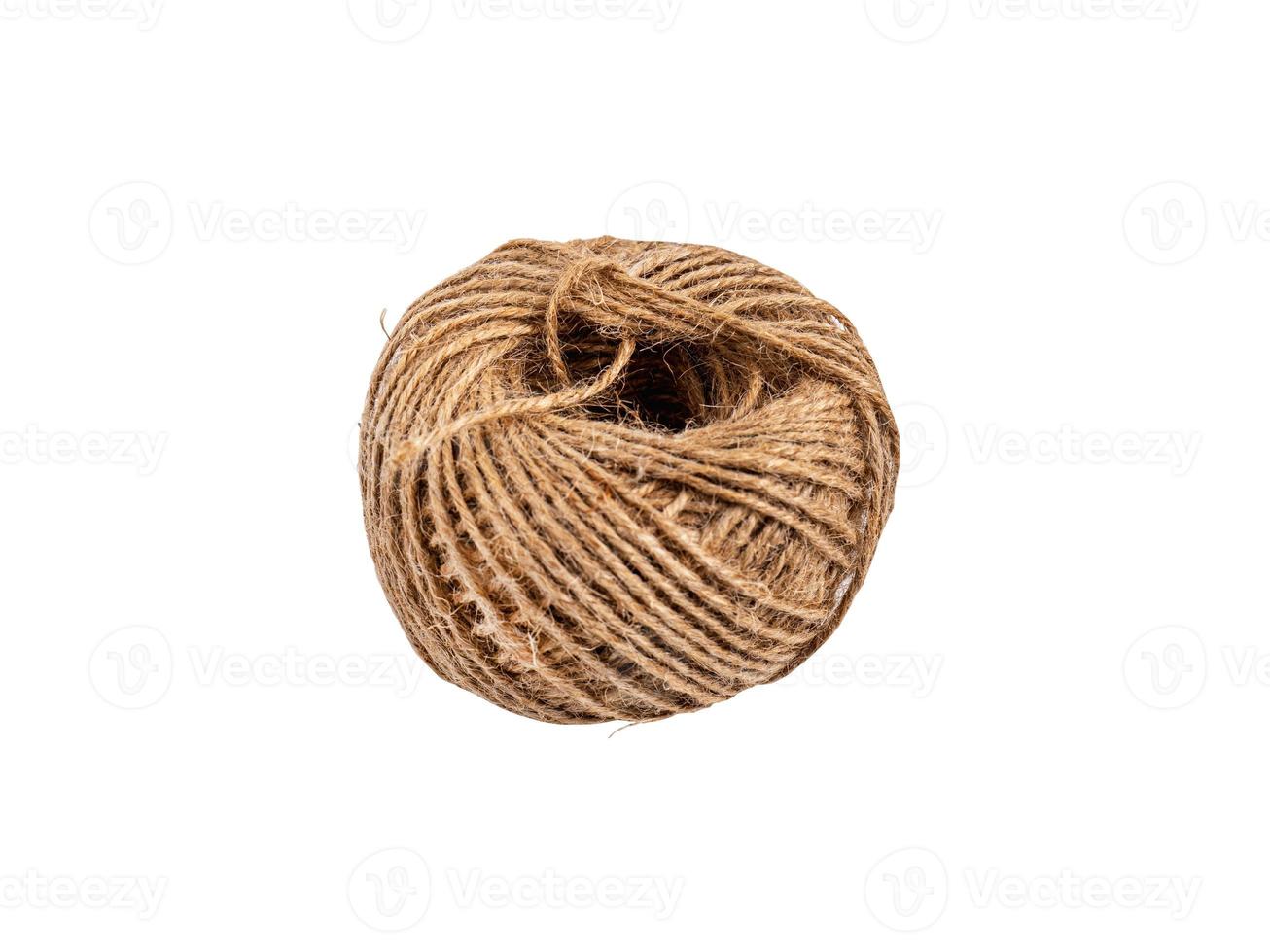 coiled raw rope Made of various fibers into a long rope. For brown crafts, white background isolated, clipping path, studio shot. photo