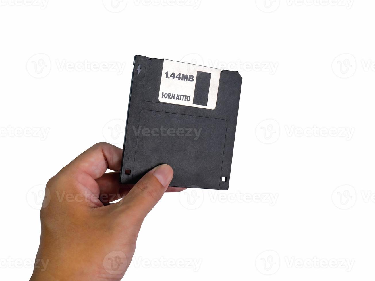 Hand holding a Floppy A disc, insert the reader. to read and write data It's technology old that have been used for a long time has a rectangular shape, white background, has Clipping path photo