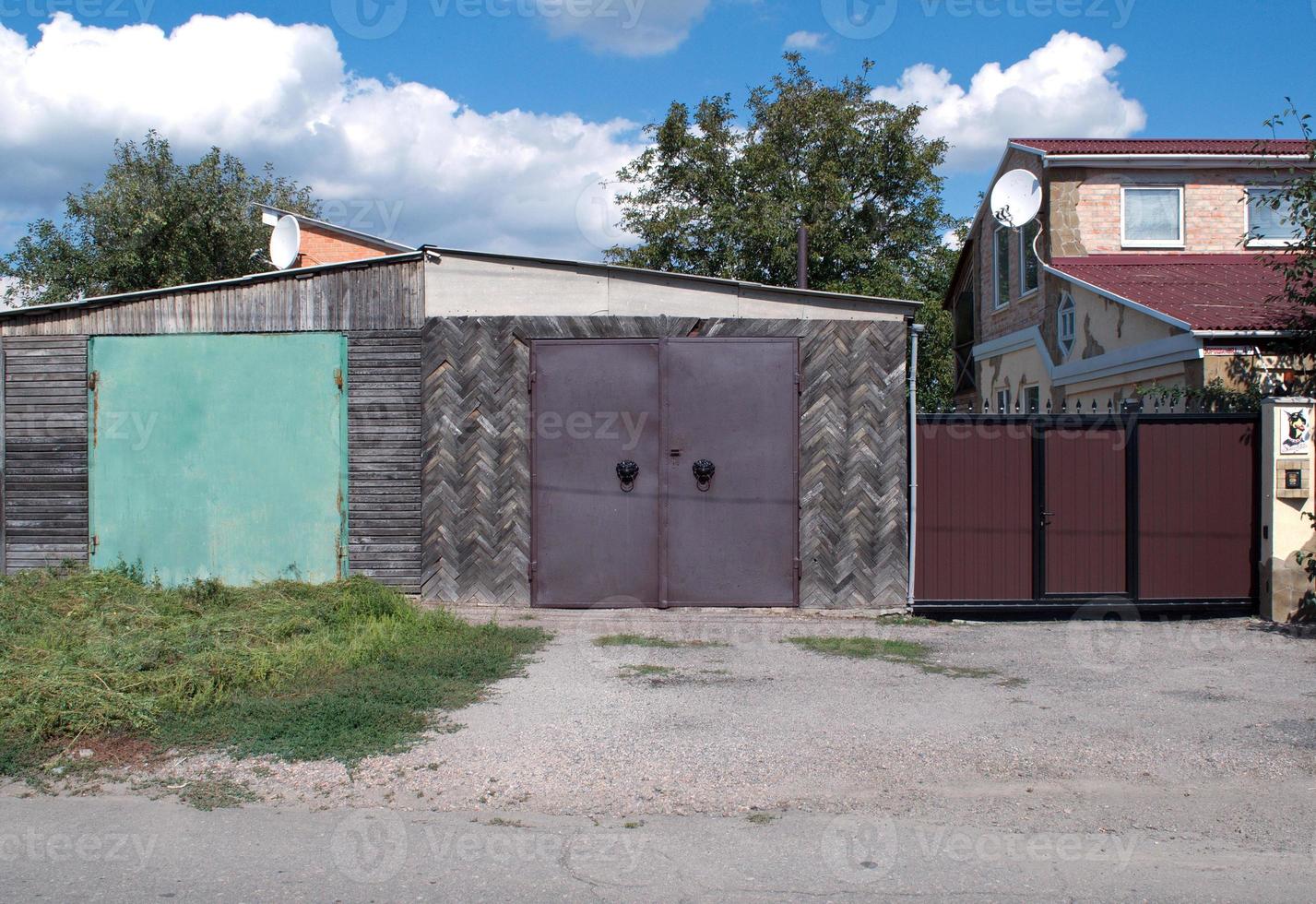 iron gate and barn photo