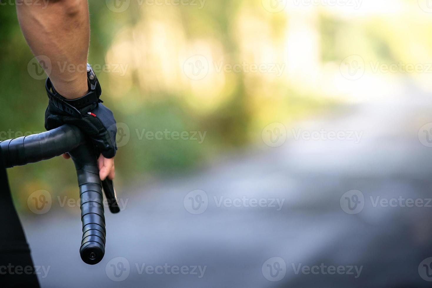 cycling athlete prepare for ride bicycle on street, road, with high speed for exercise hobby and competition in professional tour photo