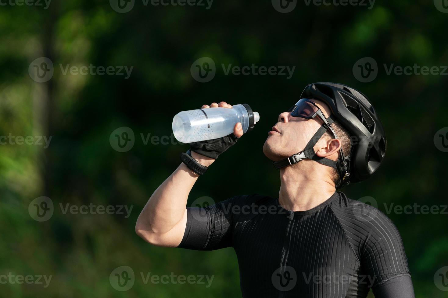 cycling drink water after ride bicycle on street, road, with high speed for exercise hobby and