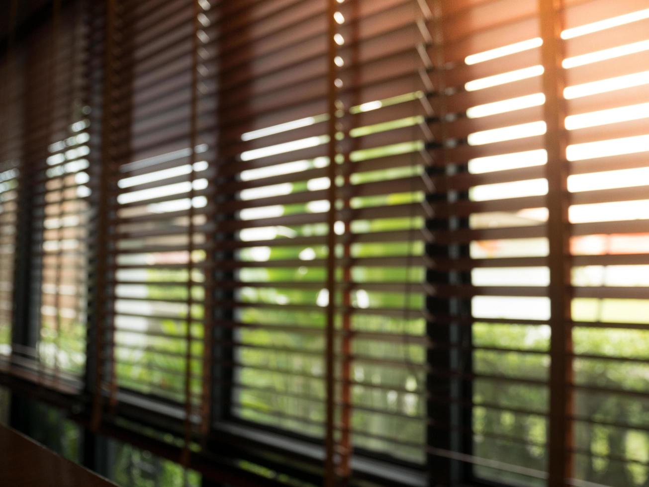 Dark interior with Window blinds at cafe selective blur focus photo