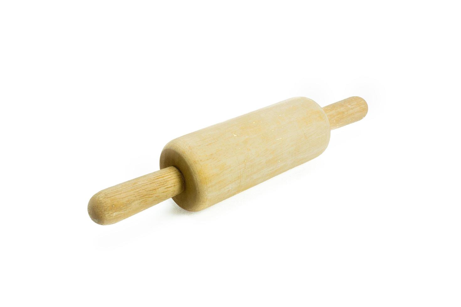 Wooden rolling pin on white background photo