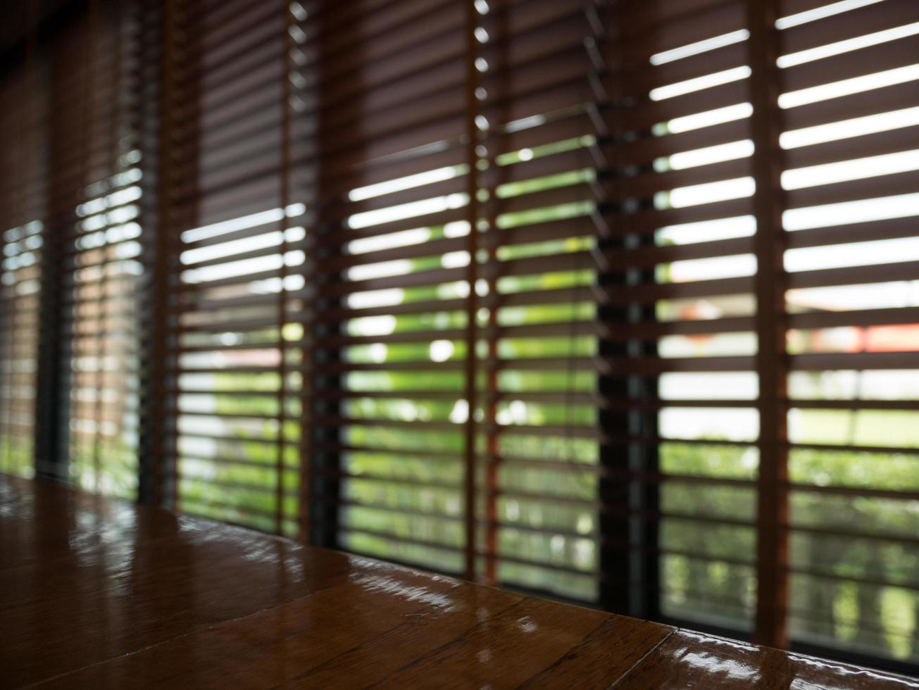 Dark interior with Window blinds at cafe selective blur focus photo