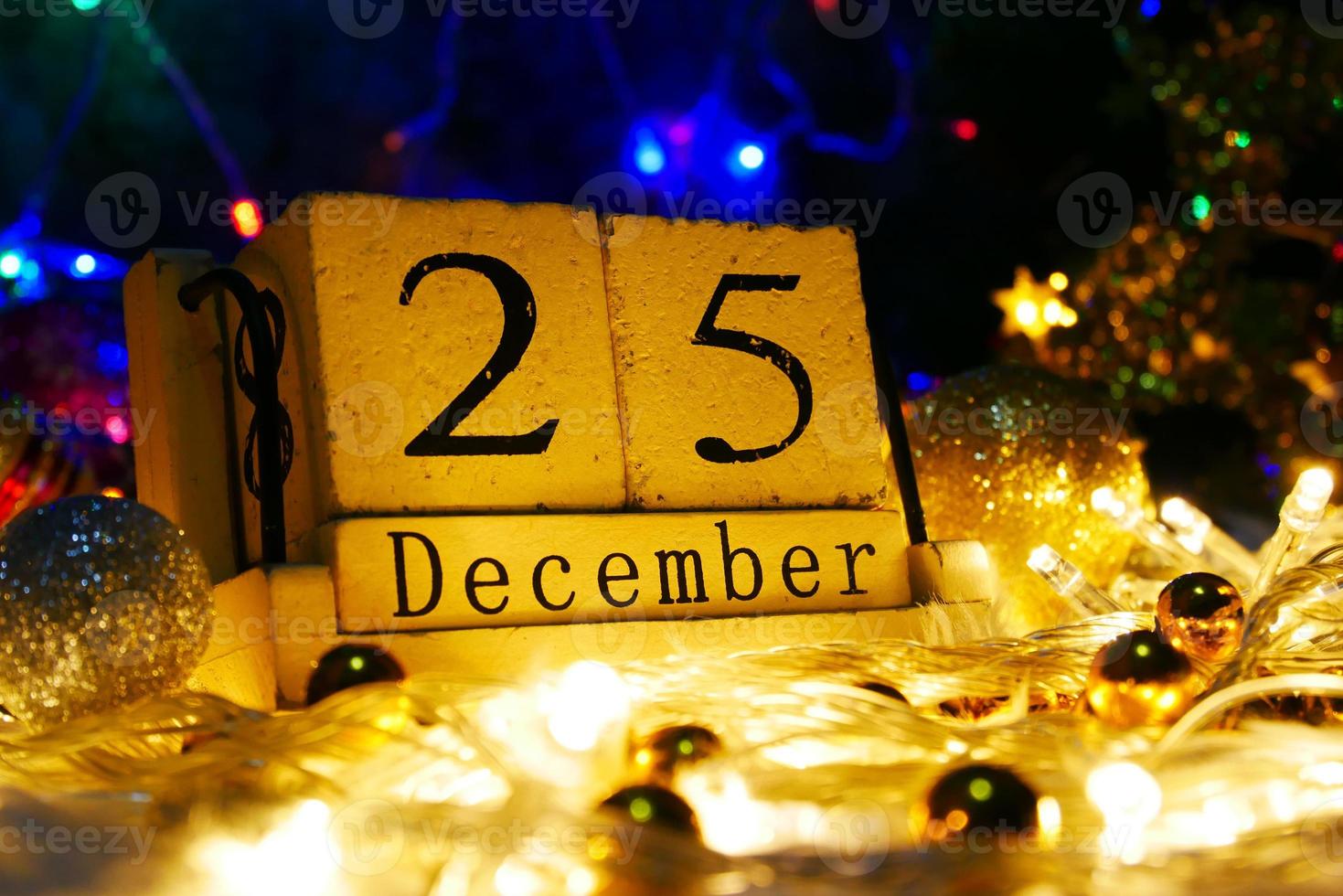 Christmas day theme with decorate and fir festive.wood cube block calendar present date 25 and month December.Celebration Christmas and x'mas concept. photo