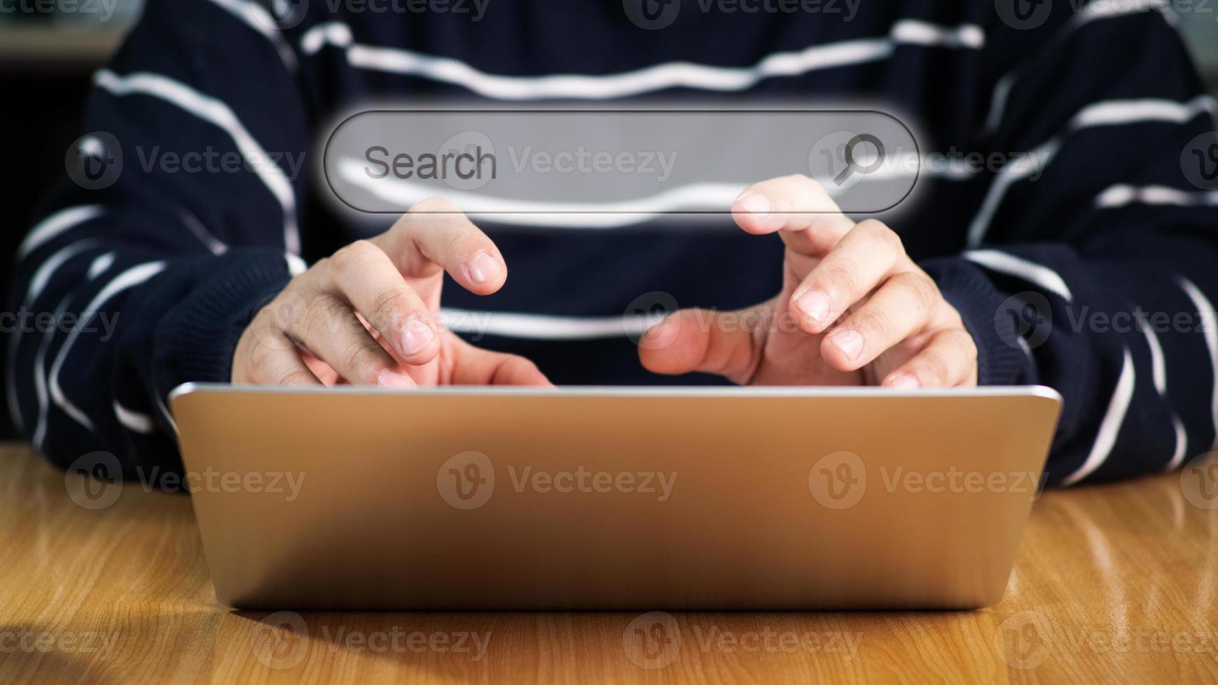 Search bar of internet browser and business man hand on laptop with visual screen search button on dark background, browsing information, internet data technology and datasearch engine concept photo