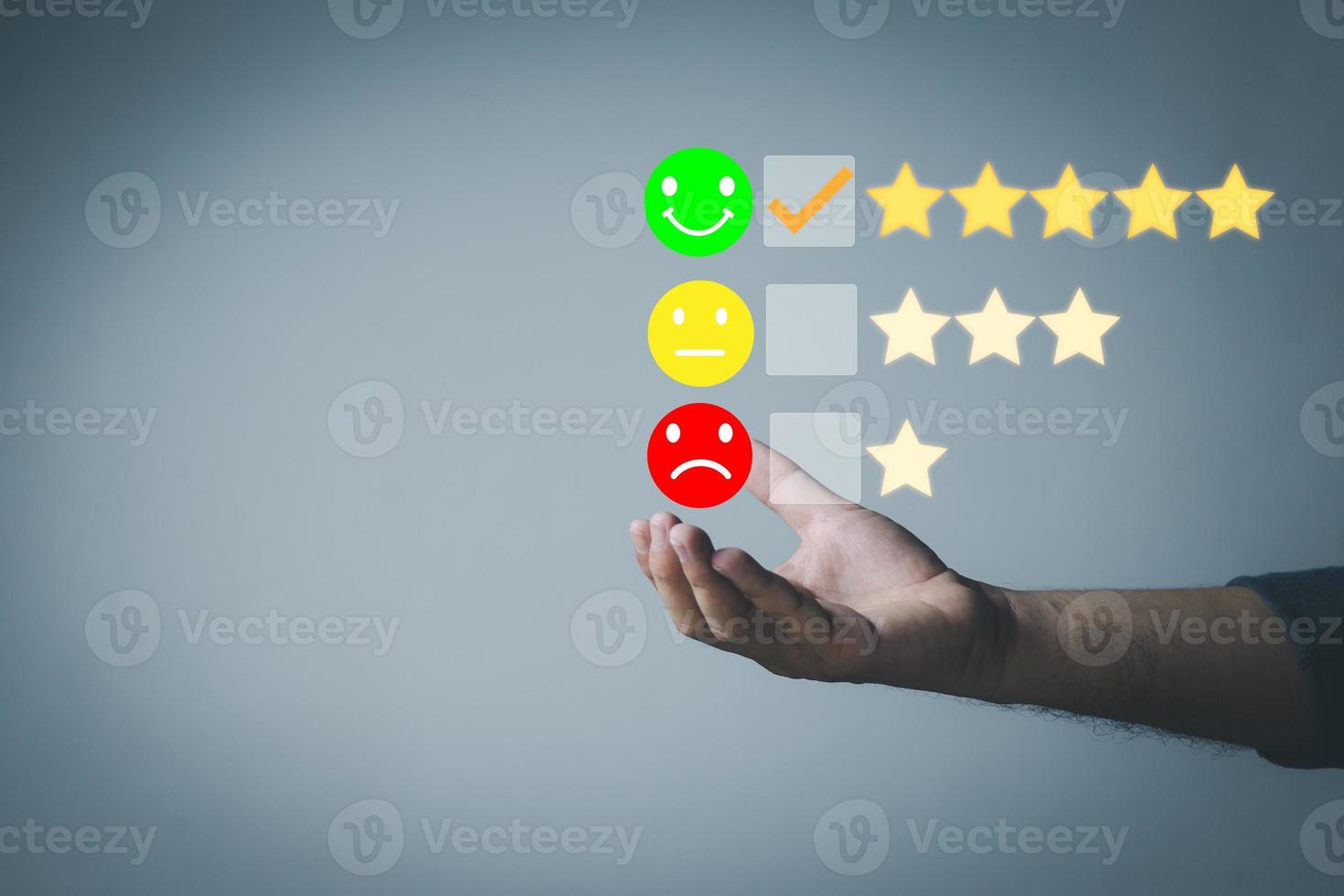 Customer service and Satisfaction concept Men's hands doing online assessments in the satisfaction rating the popular service company allows customers in order to improve and develop the organization photo