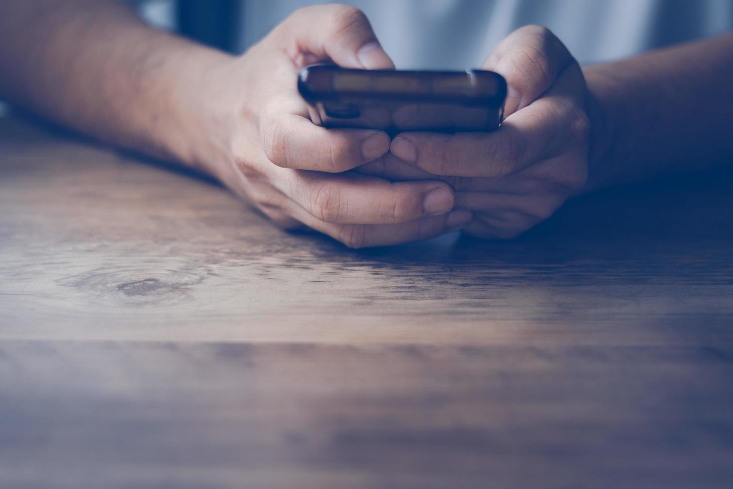 social media technology concept Men are using smartphones for social media and online marketing including working from home. and searching for information in the world photo