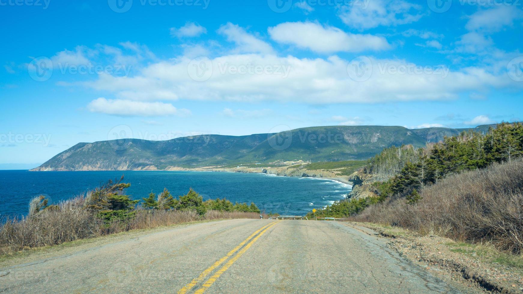 View of the mountain seen through the road Cape Breton, Nova Scotia, Canada photo