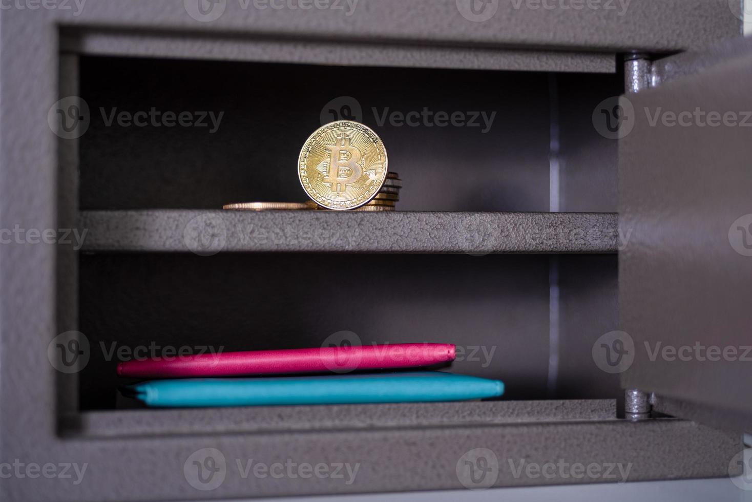 Small residential vault with physical bitcoin. photo
