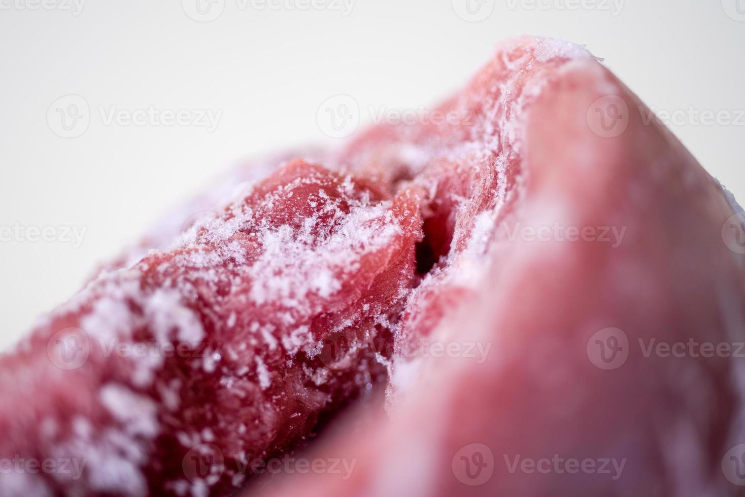 Texture of frozen fresh raw meat, close up, macro photo