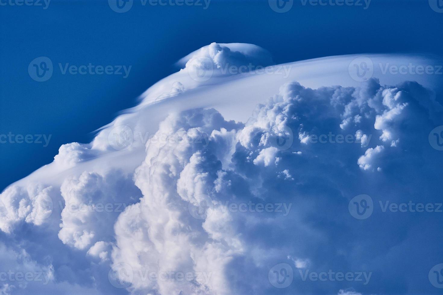 cumulonimbus clouds against blue sky photo