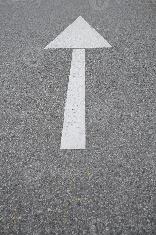 white arrow on the road photo