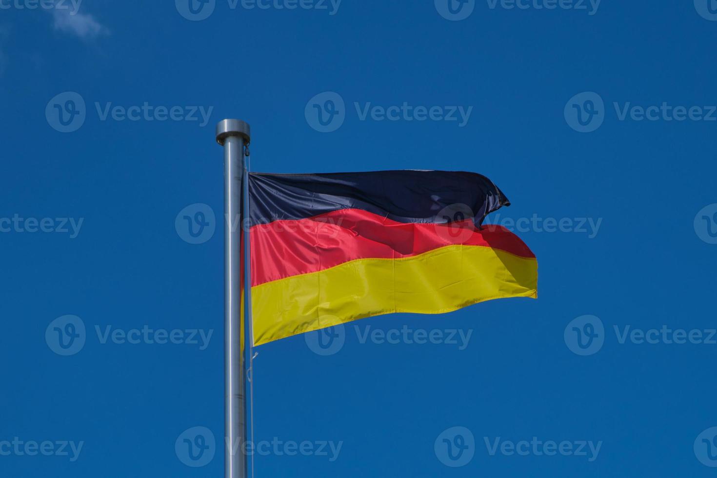 German flag against blue sky photo