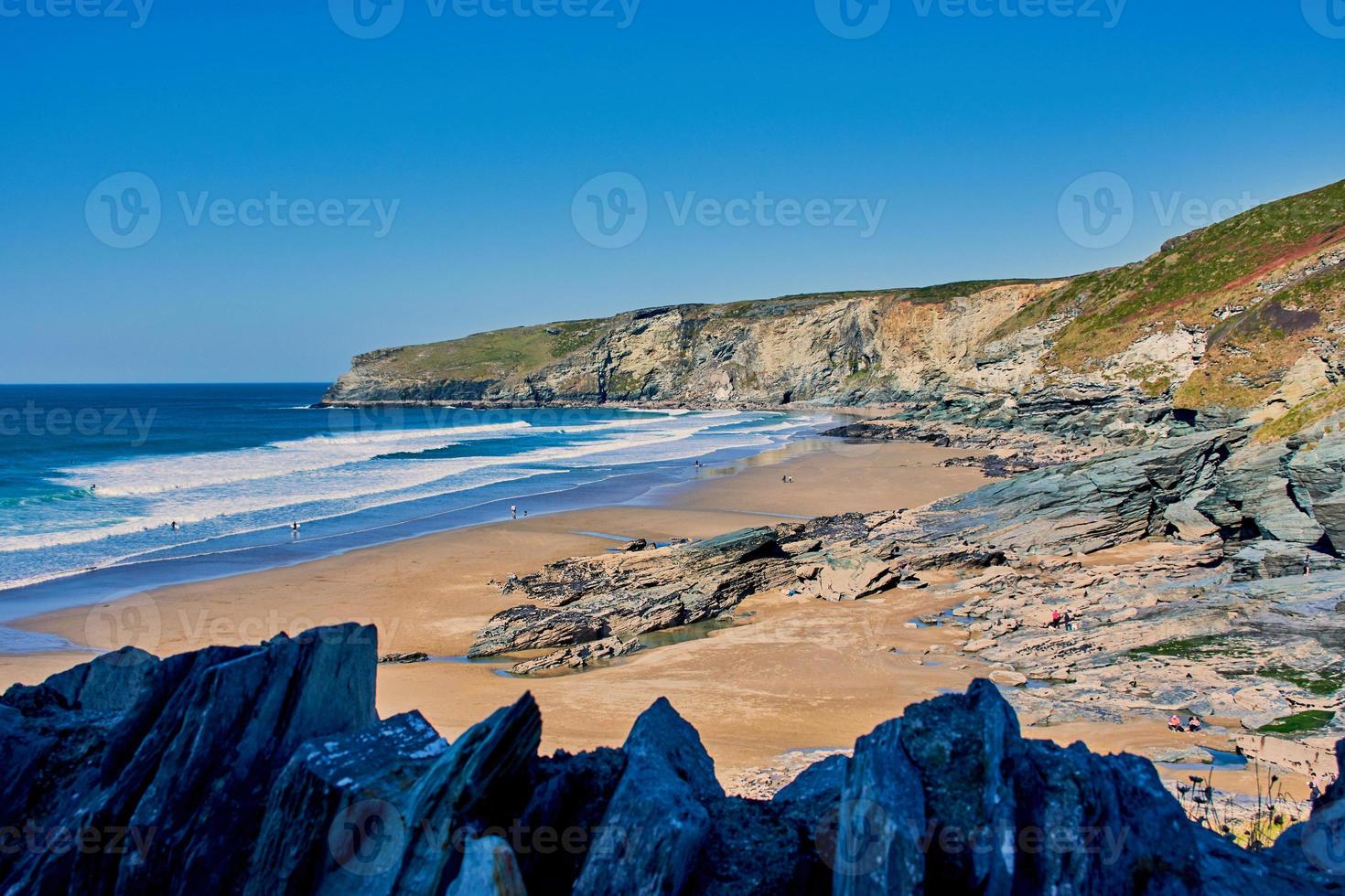 view to Trebarwith Strand beach on a sunny day photo