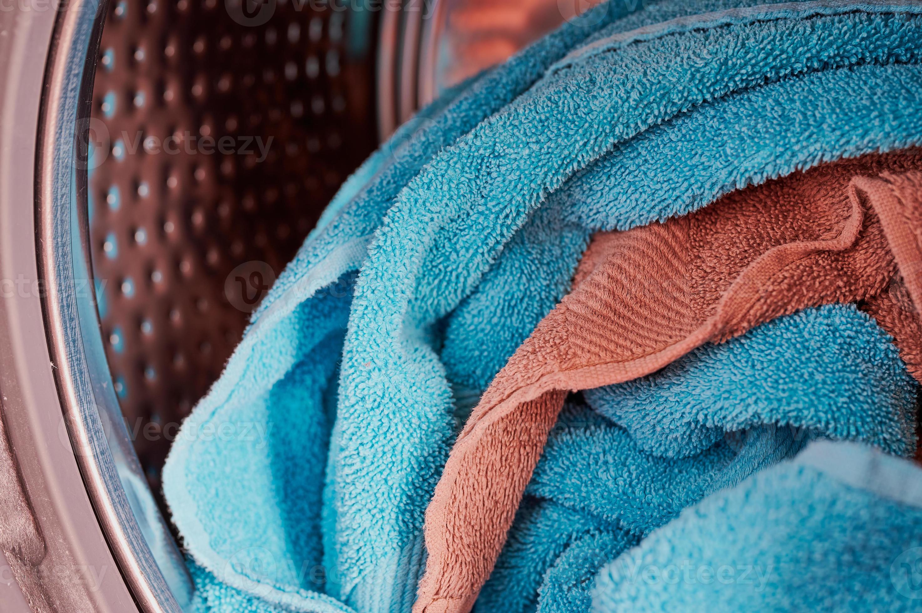 close up of a washing machine drum filled with towels 8016452 Stock