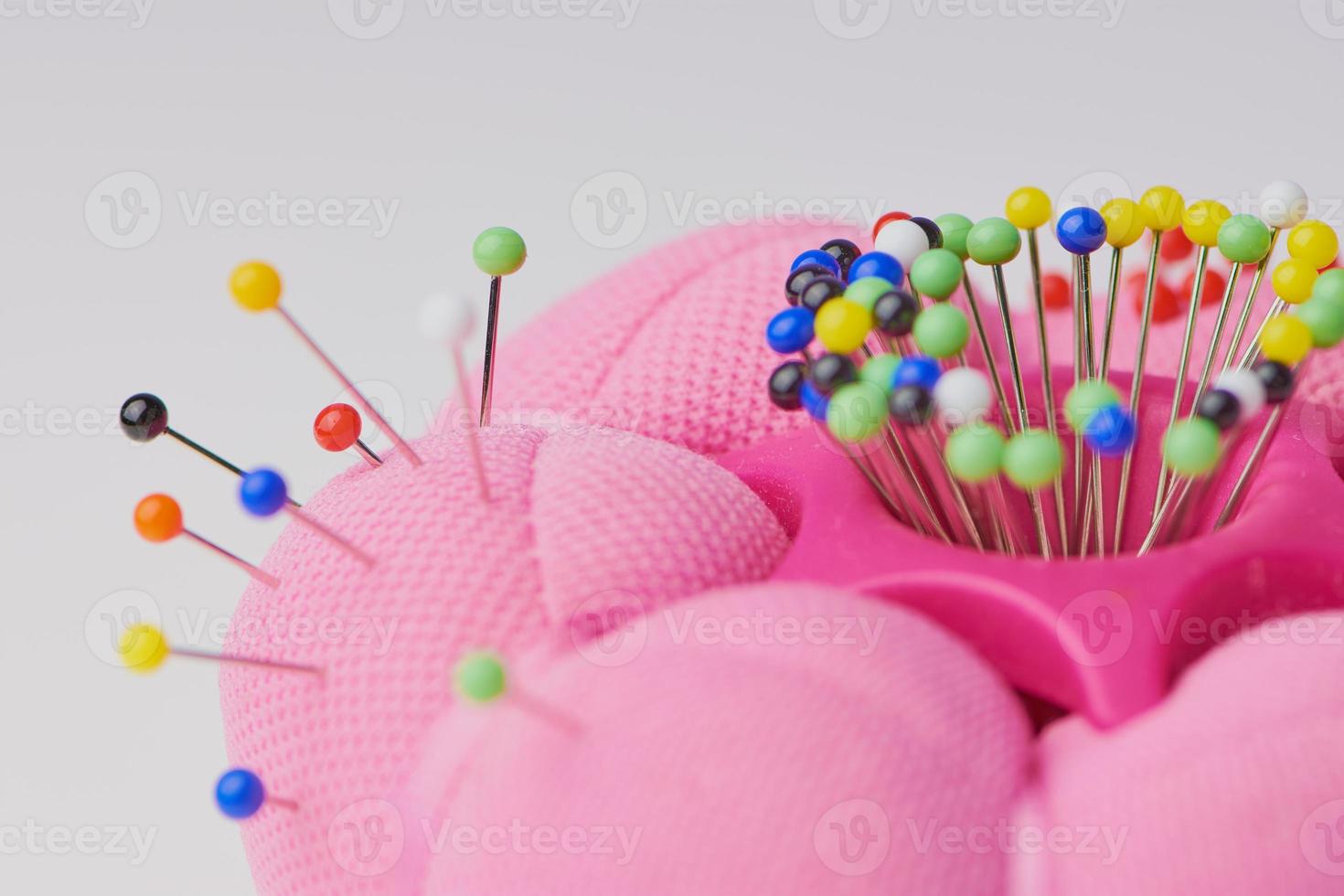 macro of a needle cushion with pins photo