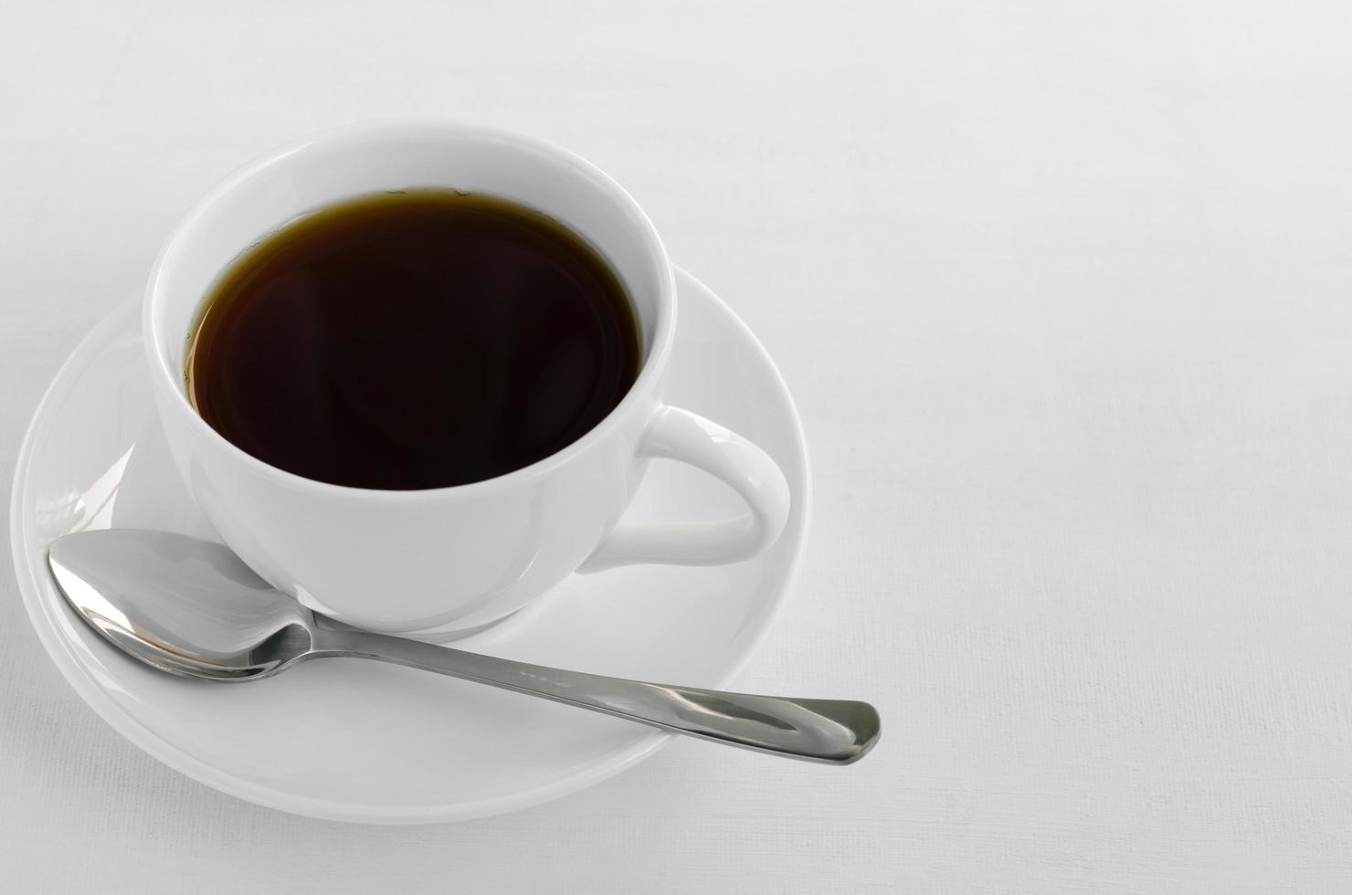 White Cup of Black Tea on White Background. photo