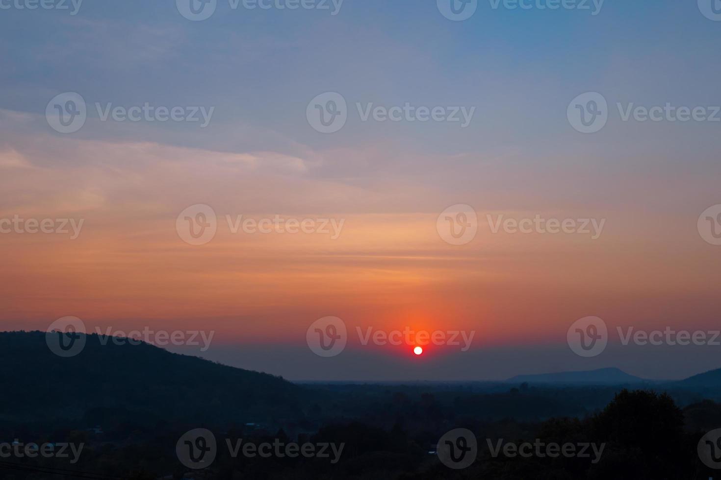 Beautiful sunset sky on the mountains. Countryside landscape under scenic sky at sunset background. photo