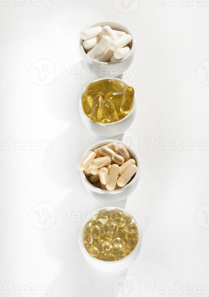 Food supplement oil filled fish oil, vitamin D, omega 3, omega 6, vitamin A, vitamin E, flaxseed oil. photo