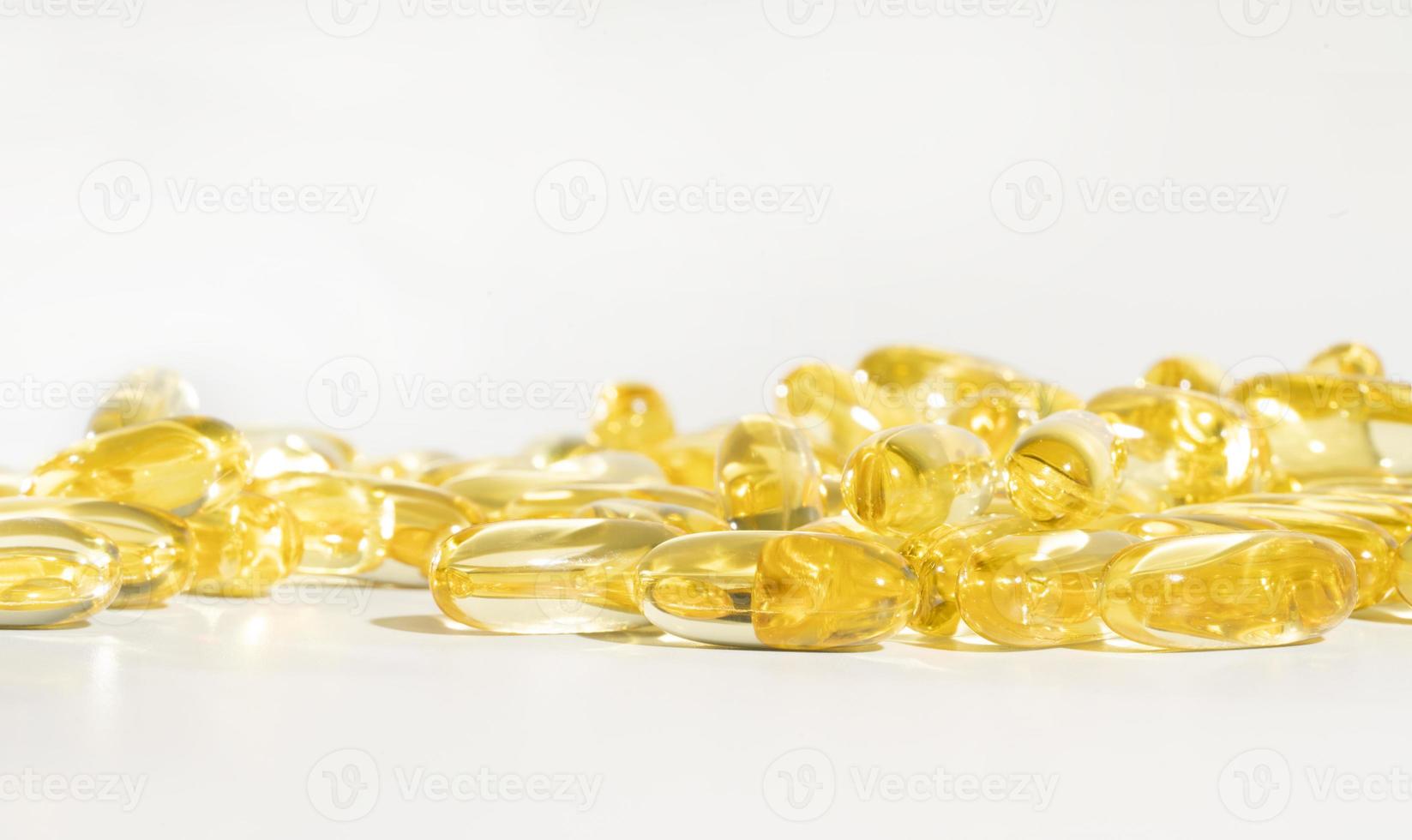 Food supplement oil filled fish oil, vitamin D, omega 3, omega 6, vitamin A, vitamin E, flaxseed oil. photo