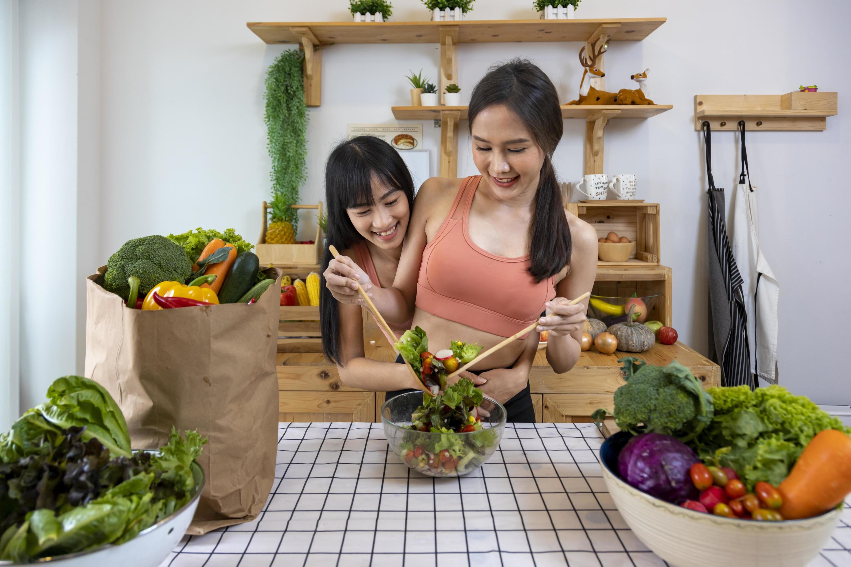 Asian couple of same sex marriage cooking healthy salad together in kitchen during pride month to promote equality and differences of homosexual and discrimination concept 8016901 Stock Photo at Vecteezy