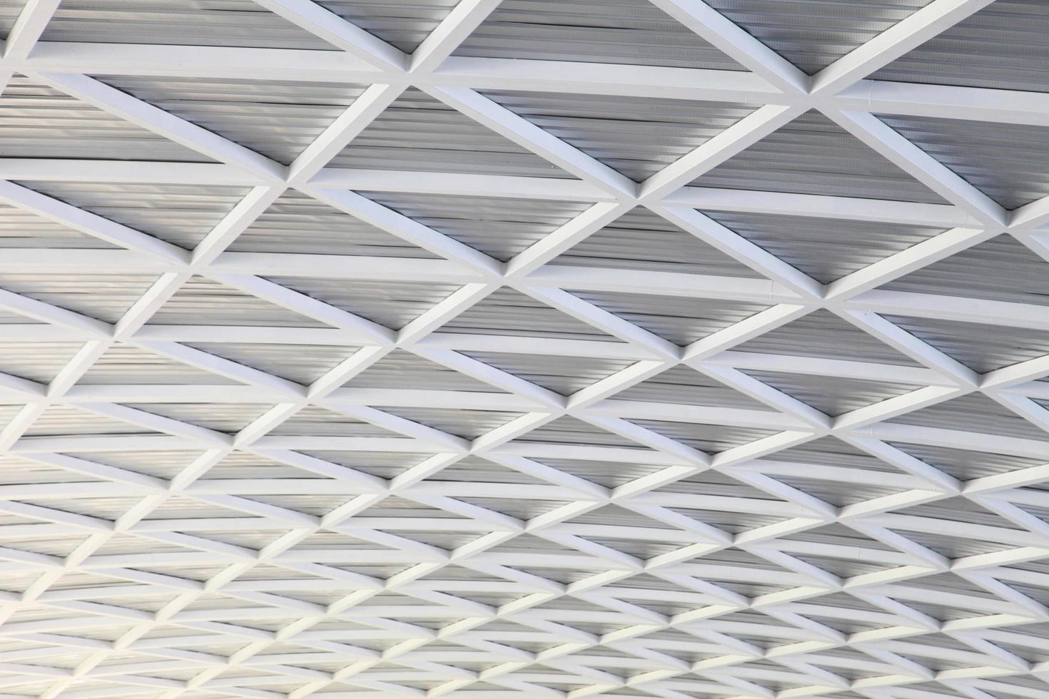Futuristic bright metallic black and white abstract curved geometrical roof design and pattern photo