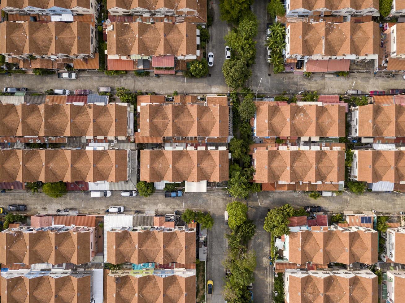 Aerial drone shot of suburb area surrounded by high density village in overpopulation city for housing and real estate property concept photo