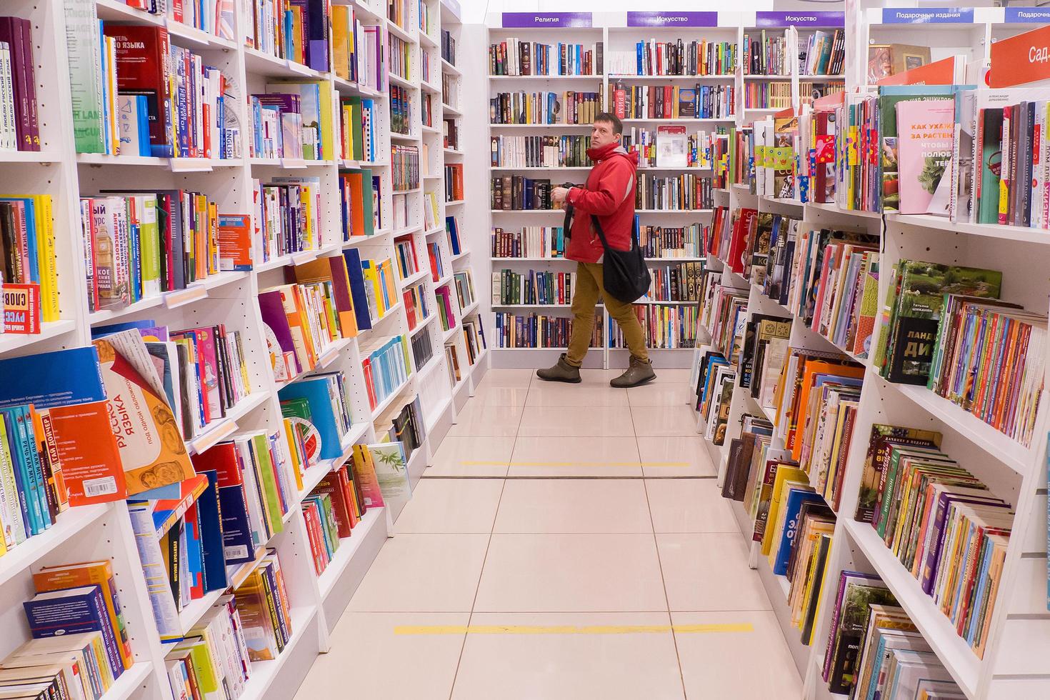 Ivanovo, Russia, February 21, 2021, a man chooses a book in a bookstore, editorial photo