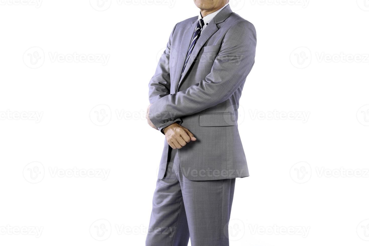 Businessman wearing an elegant suit over white background. Well-dressed senior man in the studio That emphasizes thoughtful thinking, thinking carefully. photo
