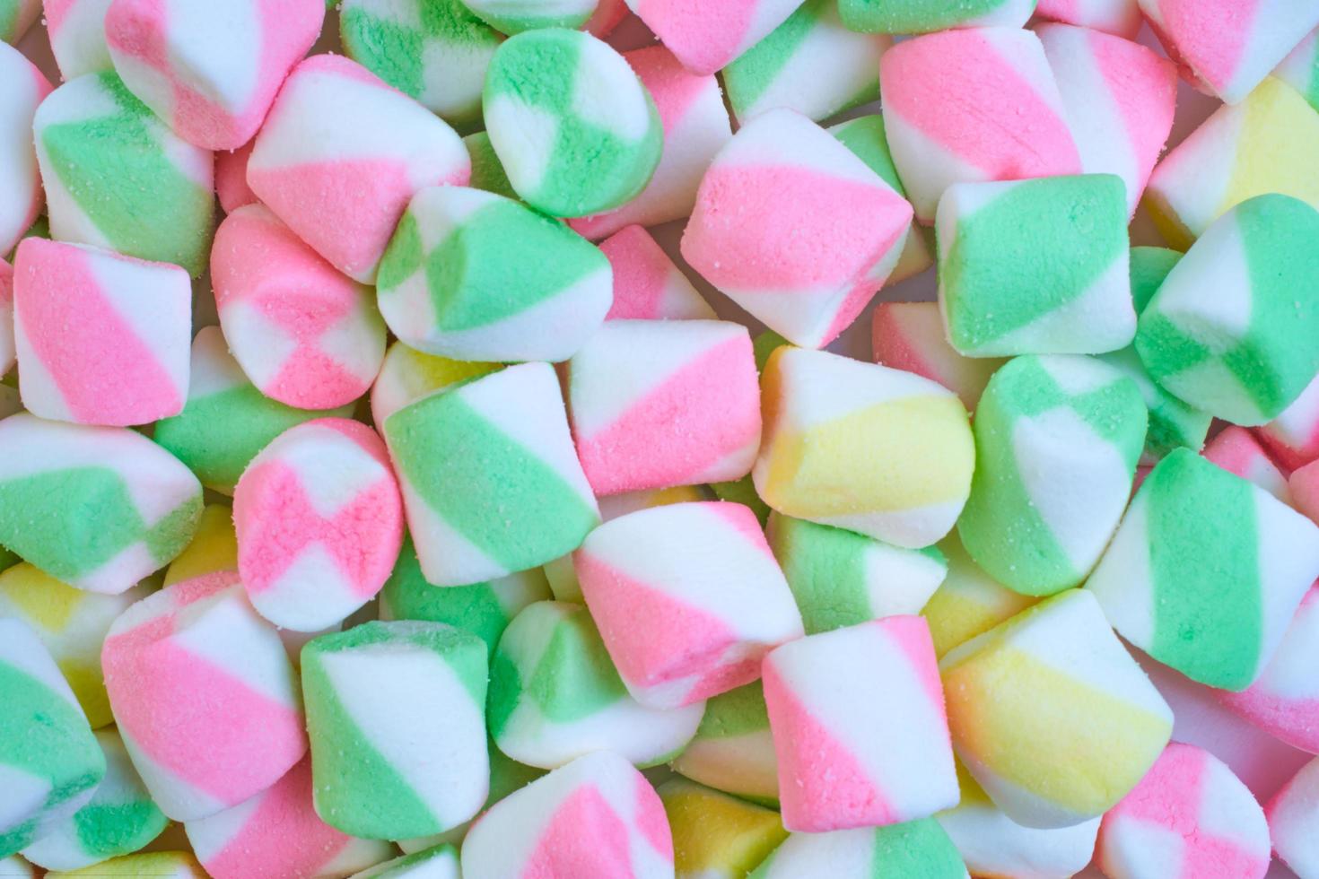Background or texture of colorful blue and pink marshmallows.Multi-colored marshmallows. photo