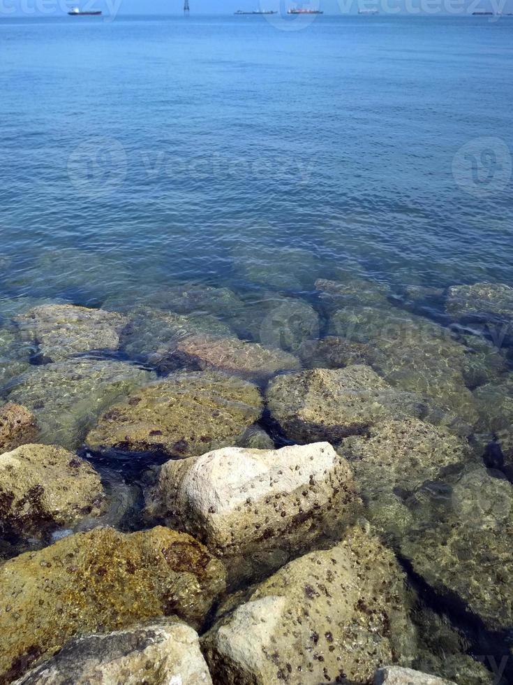 beautiful beach with coral at summertime, centre point makassar, south sulawesi, indonesia photo