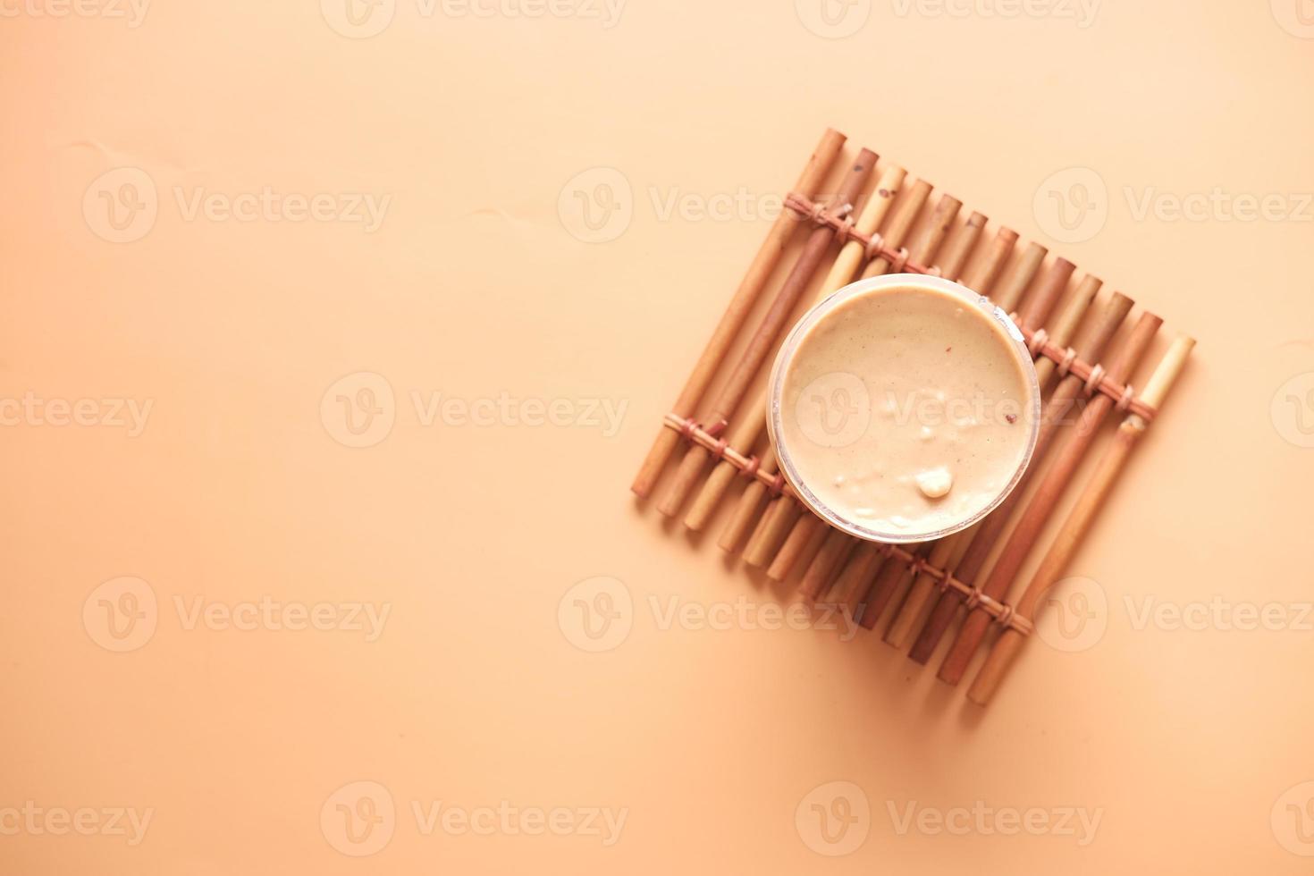 top view of peanut butter in a container , photo