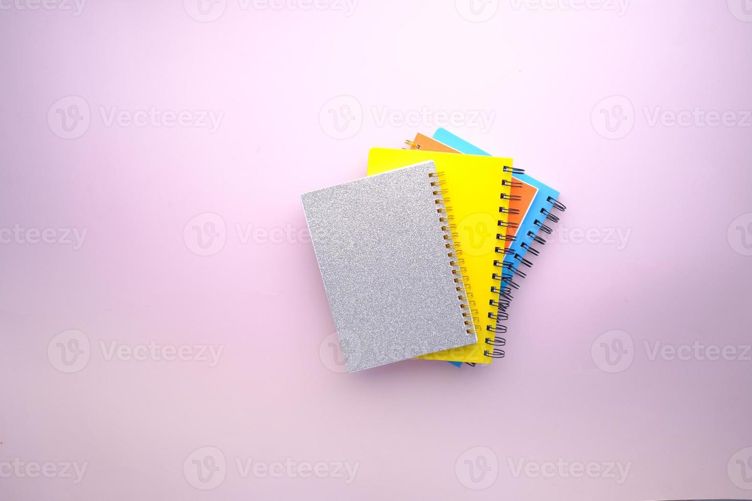 high angle view of color notepads on color background photo