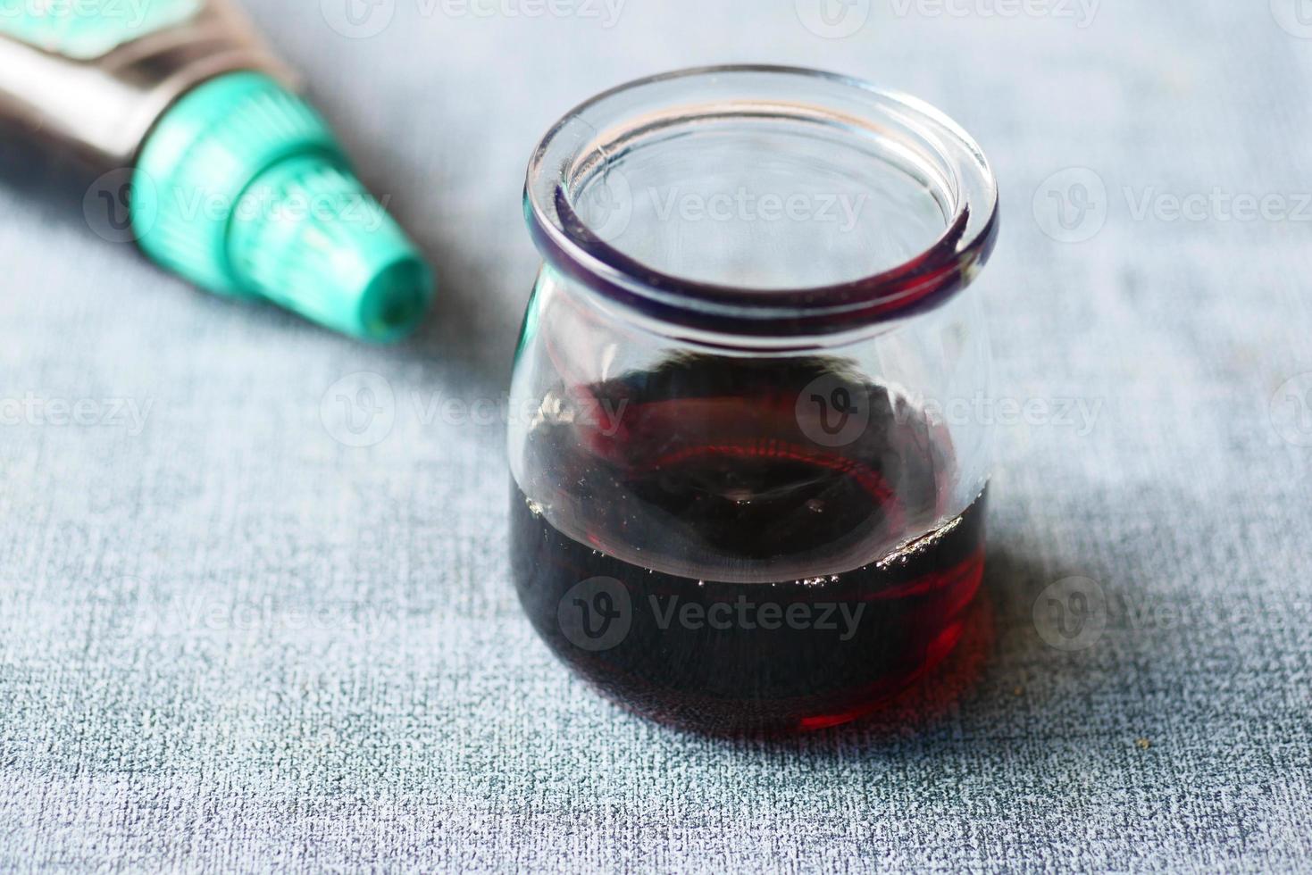 maple syrup in a small glass jar on table photo