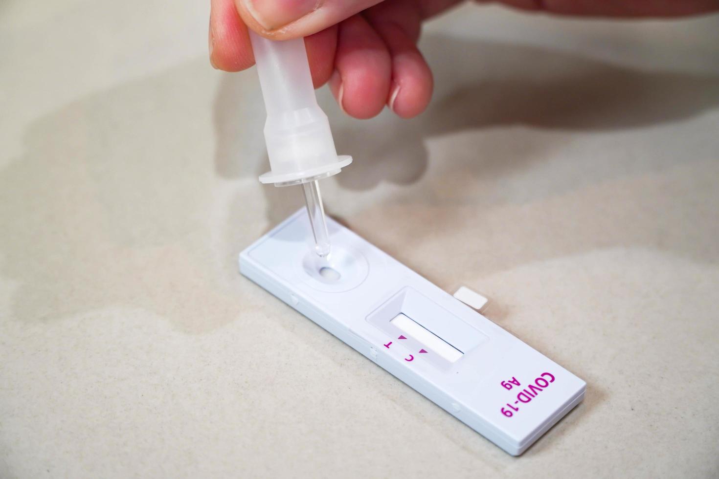 Positive test result by using rapid test for COVID-19, quick fast antibody point of care testing.Swab in the hospital laboratory photo