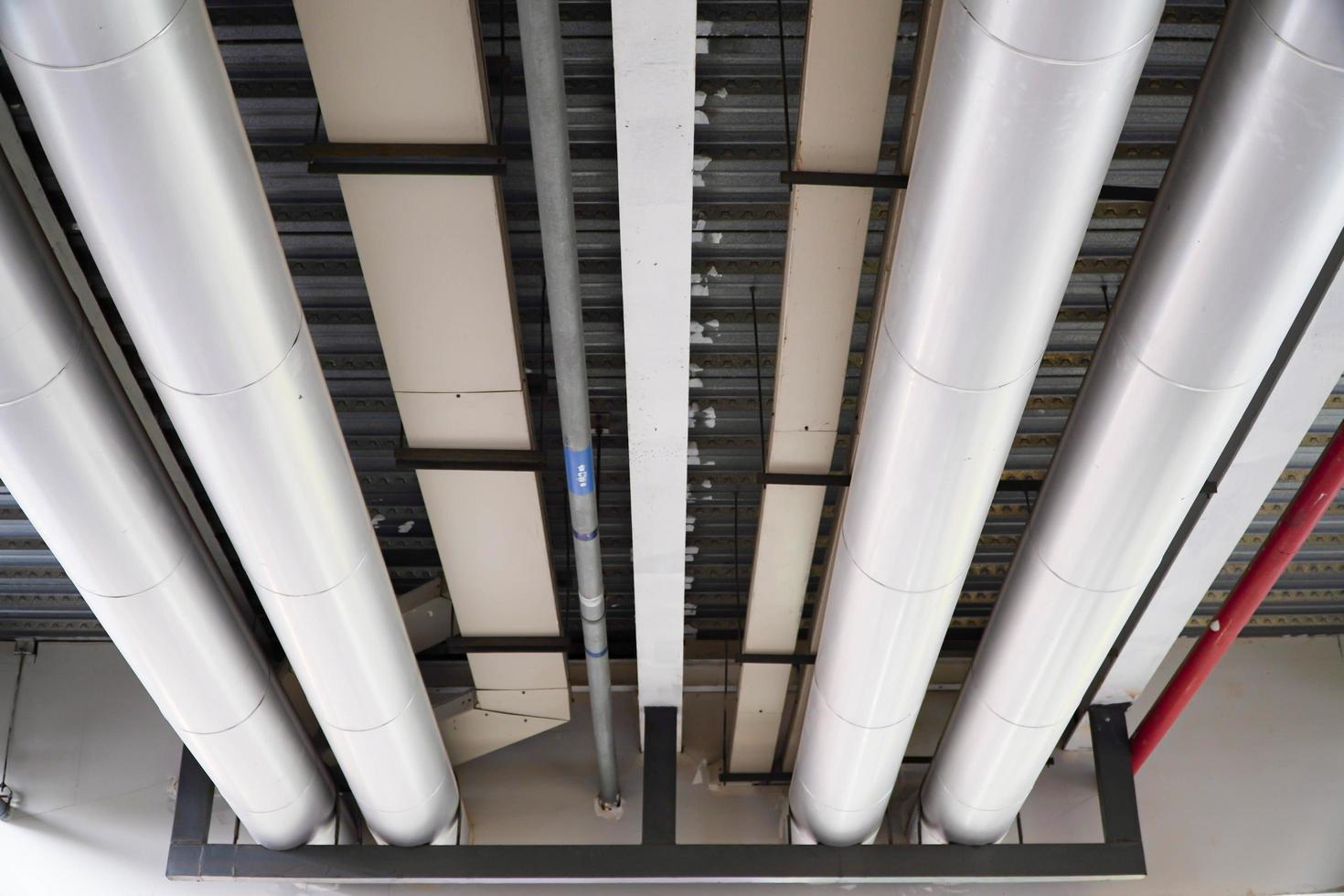 Industrial steel pipes or pipes of ventilation systems are abstract industrial equipment backgrounds.Concept of piping system in building photo