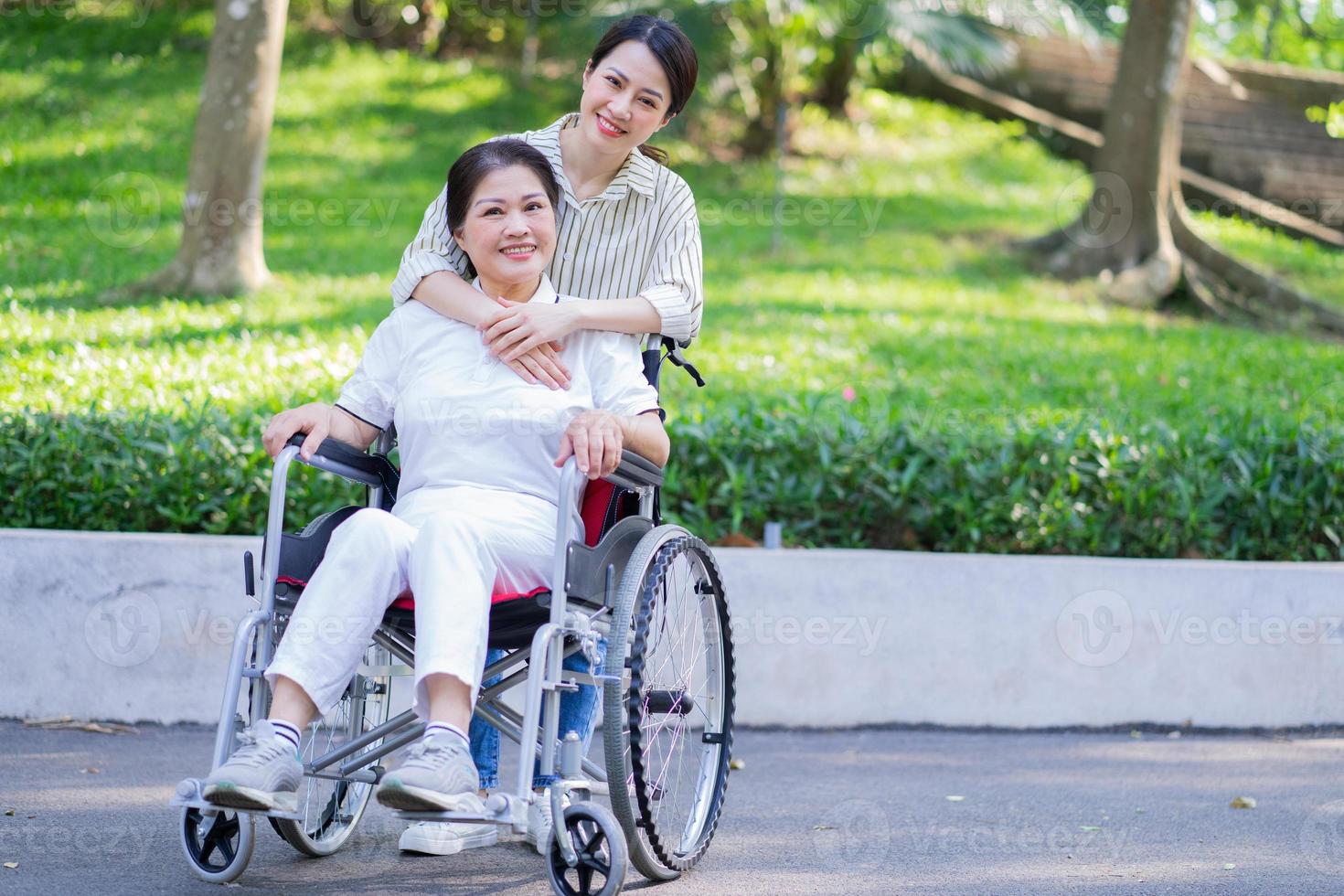 Young Asian daughter taking care of her disabled mother 8025624 Stock